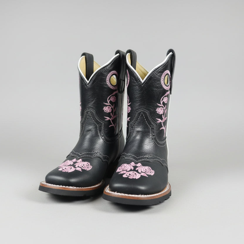 bota de piiel con adorno en rosa 